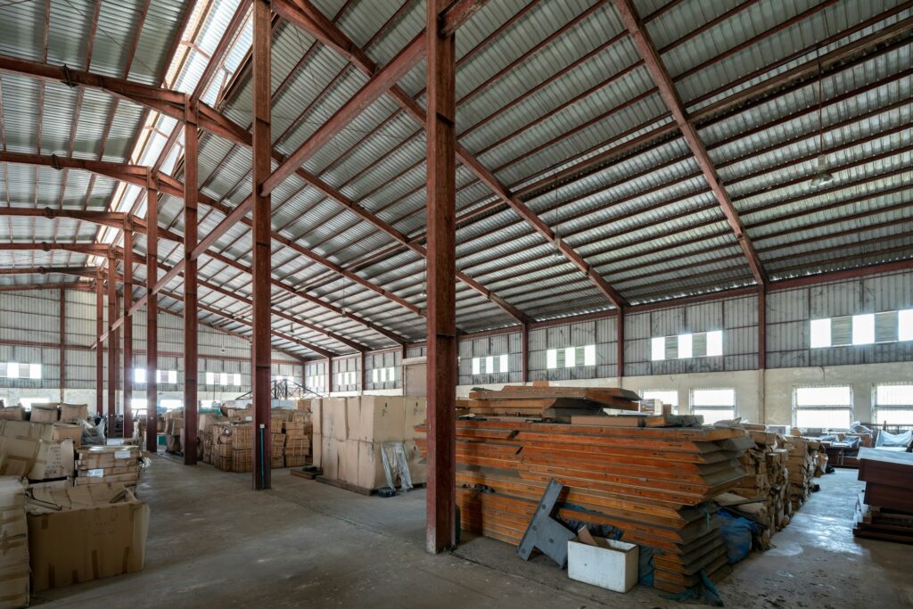 Interior shot of a warehouse filled with wood and boxes
